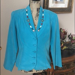 Beautiful turquoise jacket with a western flair.